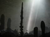 Streams of Light Unveil Stalagmites on the Floor of Hang Loong Con