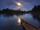 Moonlight Bathes a Birchbark Canoe on Maine's Allagash River