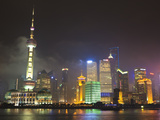 Pudong Skyline at Night across the Huangpu River  Oriental Pearl Tower on Left  Shanghai  China  As