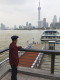 A Man Watching Ferries Crossing the Huangpu River  Shanghai  China  Asia