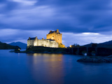Eilean Donan Castle Floodlit Against the Deep Blue Twilight Sky and Water of Loch Duich  Highlands 