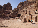 Child Riding a Donkey in Front of Cave Dwellings in Petra  UNESCO World Heritage Site  Jordan  Midd