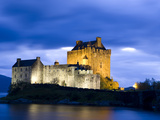 Eilean Donan Castle Floodlit Against Deep Blue Twilight Sky and Water of Loch Duich  Near Dornie  K