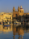 Harbour with Luzzu Fishing Boats and Marsaxlokk Parish Church at Sunrise  Marsaxlokk  Malta  Medite