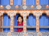 Young Buddhist Monk Looking Out of a Window at Trongsa Dzong  Trongsa  Bhutan  Asia