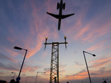 Dc9 Aircraft Approaching over Runway Landing Light Gantries at Sunset  London  England  United King