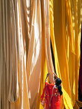 Woman in Sari Checking the Quality of Freshly Dyed Fabric Hanging to Dry  Sari Garment Factory  Raj