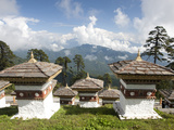 Some of the 108 Chortens Located at the Summit of the Dochu La Pass with Views Towards Mountains Be