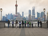 People Viewing the Pudong Skyline and the Oriental Pearl Tower from the Bund  Shanghai  China  Asia