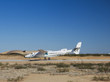 Virgin Galactic's White Knight 2 with Spaceship 2 on the Runway at the Virgin Galactic Gateway Spac