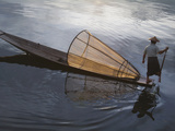 Intha Fisherman Rowing Boat with Fishing Net on Inle Lake  Myanmar  Asia