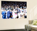 Miami  FL - June 21:  Team owner Micky Arison of the Miami Heat holds up the Larry O'Brien Champion
