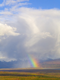 Cumulus Clouds and Rainbow over Tundra and Distant Snowy Alaska Range