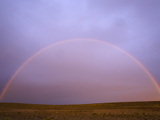 Rainbow Forming at Sunrise Above Arid Pampas Grassland Steppe