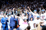 Miami  FL - June 21:  Team owner Micky Arison of the Miami Heat holds up the Larry O'Brien Champion