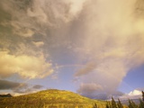 A Rainbow Shows Through Cumulus Clouds over the Mackenzie River Valley