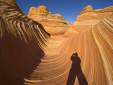 Hiker's Shadow in a Sandstone Landscape of Buttes  Pinnacles  and Ravines