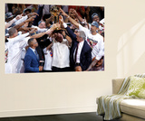 Miami  FL - June 21:  Team owner Micky Arison of the Miami Heat holds up the Larry O'Brien Champion