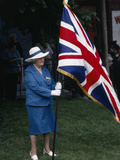 A Local Participates in Canada Day by Holding a British Flag