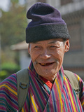 An Old Man at Trashigang Wearing the Traditional Gho Robe of All Bhutanese Men
