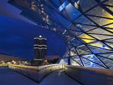 Twilight View of the Pedestrian Bridge Link to the BMW Headquarters Office Building and Museum  BMW