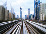 Opened in 2010  the Dubai Metro  Mrt  in Motion Along Sheikh Zayed Road at Dusk  Dubai  United Arab