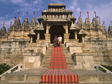 India  Rajasthan  Ranakpur  a Couple Descend Steps at the Famous Chaumukha Mandir  an Elaborately S