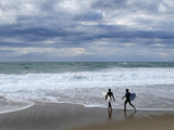 Surfers on Grande Plage Beach  Biarritz  Aquitaine  France