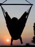 Malawi  Lake Malawi National Park  Young Guest Relaxes in a Hammock at Pumulani Lodge  (MR)