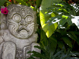 Bali  Ubud  a Stone Carving  Adorned with a Hibiscus Flower  Sits in Tropical Gardens