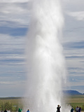 Visitors Watching the Famous Strokkur Geyser Which Erupts Every 8 to 10 Minutes  Thrusting Hot Wate