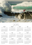 Surf Crashing near Surfer on Boulders