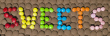 Chocolate Candies Spelling the Word Sweets