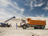 Workers with Heavy Equipment on Construction Site to Build Hotel on Land