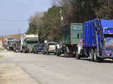Row of Trucks Entering the Charleston County Landfill  Charleston  South Carolina  USA