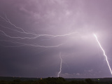 Multiple Cloud to Ground and Intracloud Lightning Flashes Behind a Storm Near Norman  Oklahoma