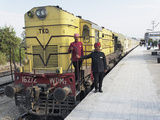Staff Members for the Palace on Wheels Train Posing with the Train  Udaipur  India