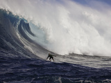 A Tow-In Surfer Drops Down the Face of Big Surf at Peahi (Jaws) Off Maui  Hawaii  USA