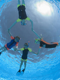 Children Playing Making Star Shapes While Snorkeling  Egypt