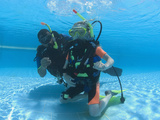 Instructor Training a Young Girl During Junior Open Water Course  Egypt
