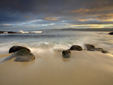 Waves Crashing over Rocks and onto a Sandy Beach in a La Jolla Cove at Sunrise  California  USA