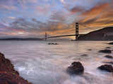 A Low Tide  Sunset View of Waves Crashing onto the Rocky Coast on the Shore of San Francisco Bay