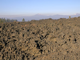 7000 Year-Old Aa Lava Flow from Lava Butte with Volcanic Peaks of the Cascade Mountains