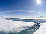 During the Arctic Spring  the Surface of the Frozen Arctic Ocean Begins to Crack under Stress