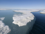 During the Arctic Spring  the Surface of the Frozen Arctic Ocean Begins to Crack under Stress