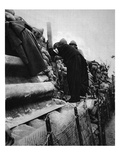 A French Priest in the Lines: a Cure Taking a Peep Through a Trench-Periscope