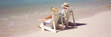 Couple Sitting in Adirondack Chairs on the Beach  Bahamas