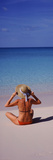 Rear View of a Woman Sitting on the Beach  Bahamas