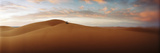 Couple Sitting on Top of a Sand Dune in the Sahara Desert  Morocco