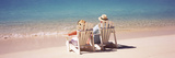 Couple Sitting in Adirondack Chairs on the Beach  Bahamas